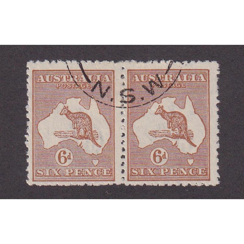 (ST1162) AUSTRALIA · 1923: used pair of Die IIB 6d chestnut Roo (3rd Wmk) · RGH unit has BROKEN LEG variety (pos. 3L/6) BW 21(3)s · some poorly punched perfs but an o/wise attractive example · c.v. AU$200 (2 images)