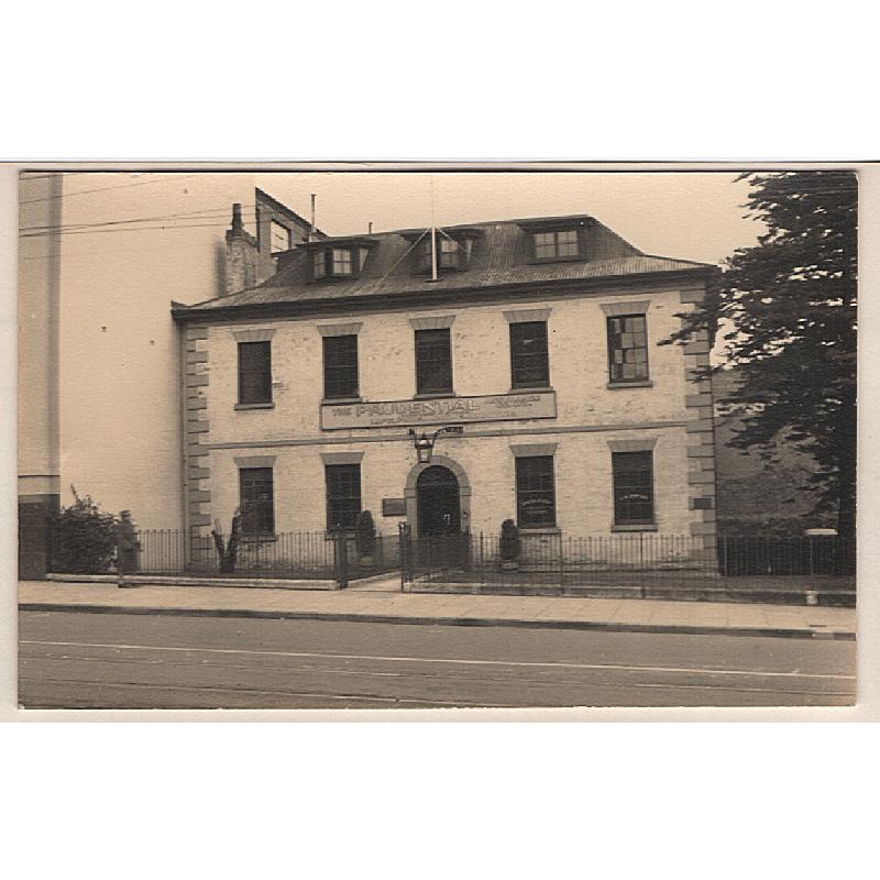 (WW15126) TASMANIA · 1920s: postcard size real photo of THE PRUDENTIAL ASSURANCE CO LTD in Macquarie St., Hobart · the Norfolk Pine is still there!!