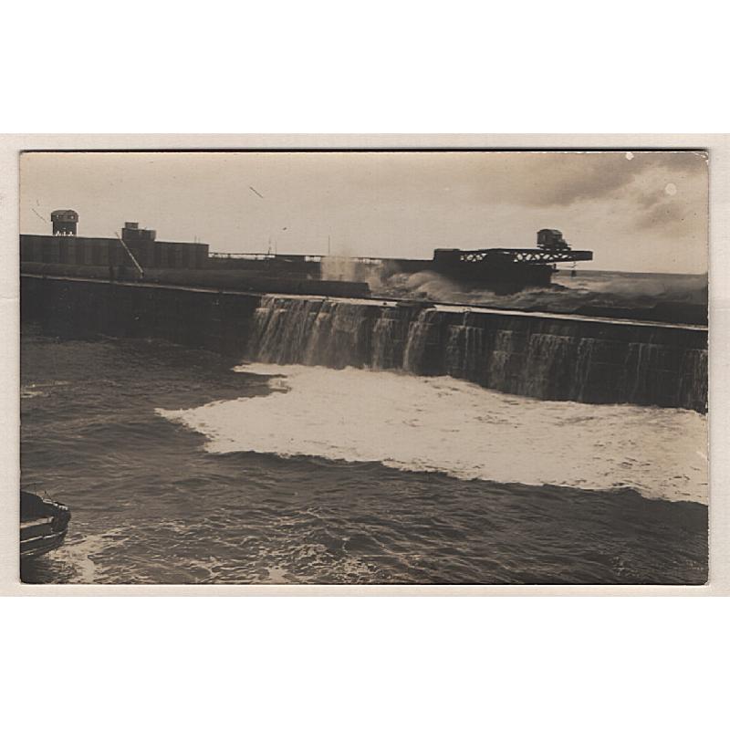 (WW15143) TASMANIA  · c.1910: unused real photo postcard by Ernest Winter with a view of heavy seas battering the BURNIE WHARVES · fine condition